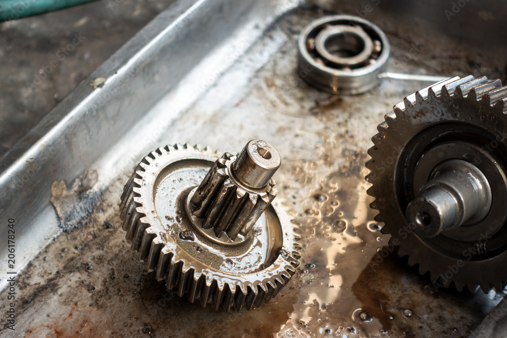 Old shiny motorcycle gears. Disassembly of the engine Old shiny motorcycle gears. Disassembly of the engine