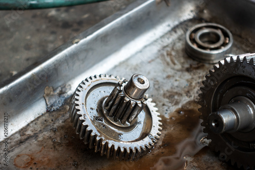 Old shiny motorcycle gears. Disassembly of the engine