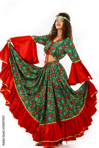 Pretty woman dancer with a gypsy dress