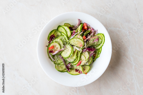 Asian Cucumber Salad with Sesame and served with Chopsticks.