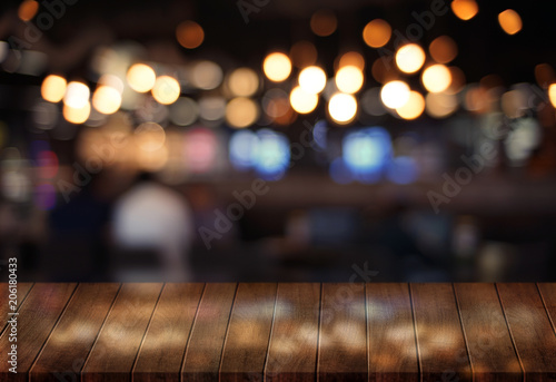 Wooden board empty table  cafe  coffee shop  bar blurred background can be used for display or montage your products and Mock up