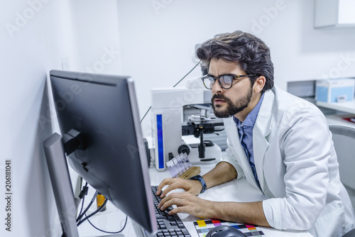 Male doctor at work in clinic office