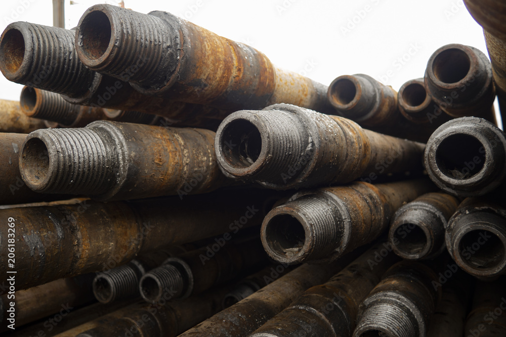 Oil drill pipe, Drill Pipe Stacked on Pipe Deck Stock Photo | Adobe Stock