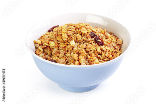 Bowl of whole grain muesli isolated on white background
