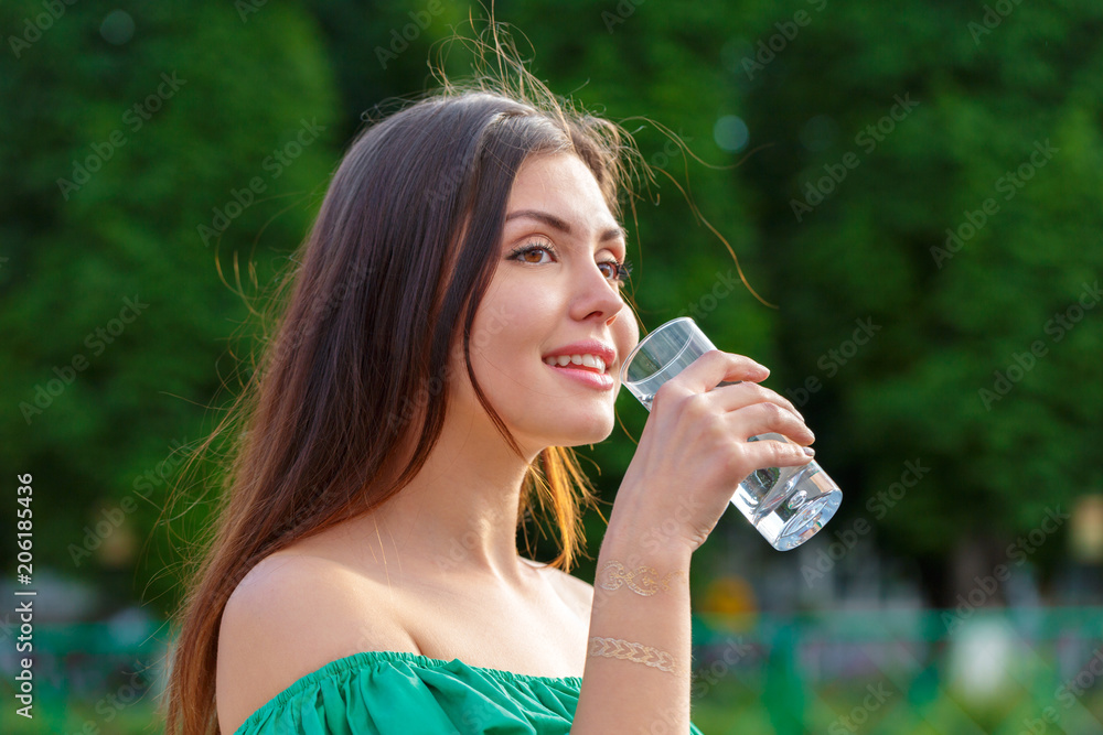 Female drinking from a glass of water. Health care concept photo Female drinking from a glass of water. Health care concept photo