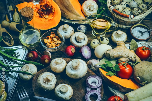 mushrooms and pumpkin. cooking healthy food. spices and ingredients. wooden background. © Михаил 