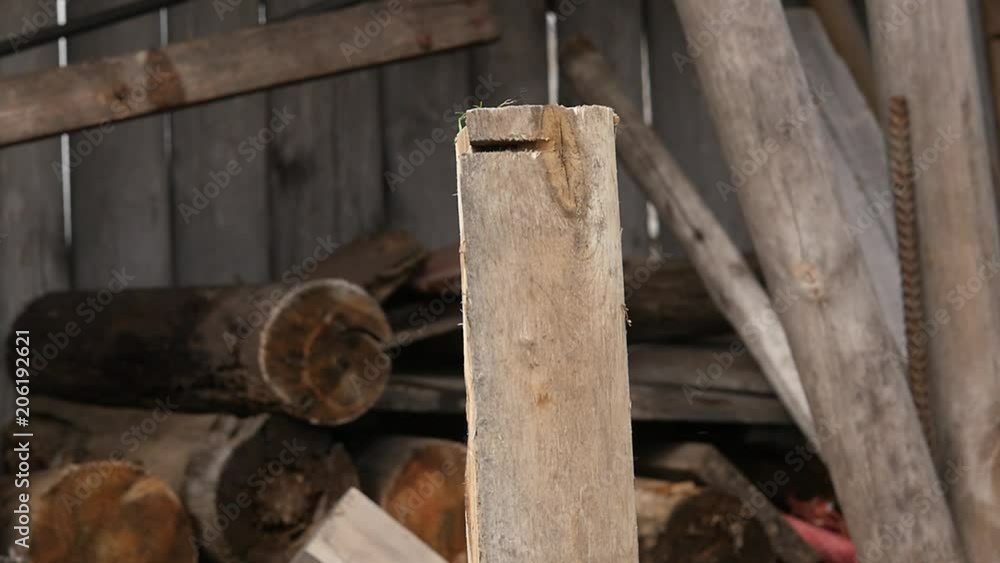 Lumberjack splitting wood and cutting firewood with old axe. slow motion Lumberjack splitting wood and cutting firewood with old axe. slow motion