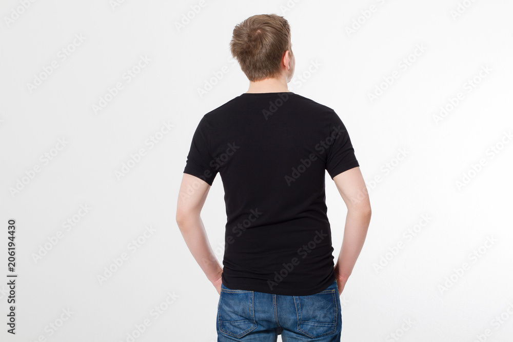 Fototapeta premium Young man wearing blank t-shirt isolated on white background. Copy space. Place for advertisement. Back shirt view