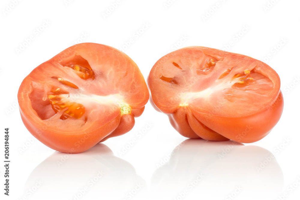 Two beef tomato halves isolated on white background big ripe red ribbing. Two beef tomato halves isolated on white background big ripe red ribbing.