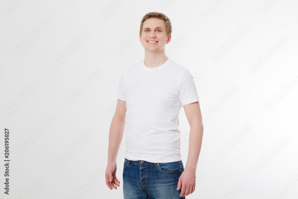 Front view. Young man wearing blank white t-shirt isolated on white background. Copy space. Place for advertisement Front view. Young man wearing blank white t-shirt isolated on white background. Copy space. Place for advertisement