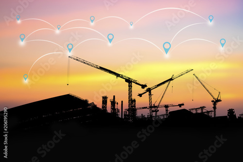 Silhouette  building construction with connection line and sunset  concept as investmen