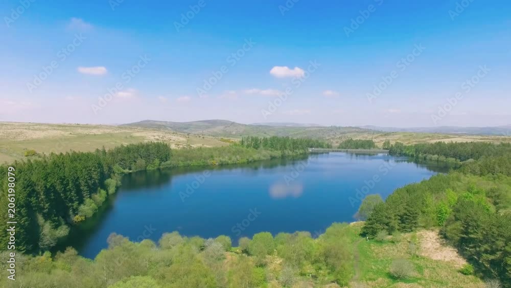 Aerial Shot Of Large Lake Behind Forest Aerial Shot Of Large Lake Behind Forest