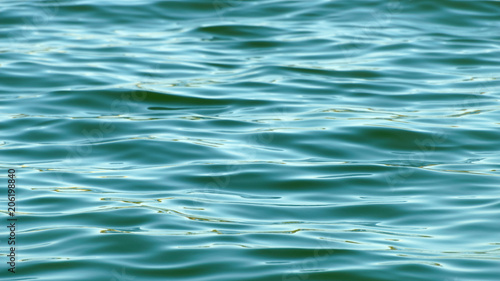 Sea surface as natural background, color toned.