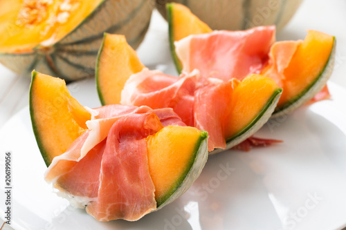 Slices of cantaloupe melon with ham