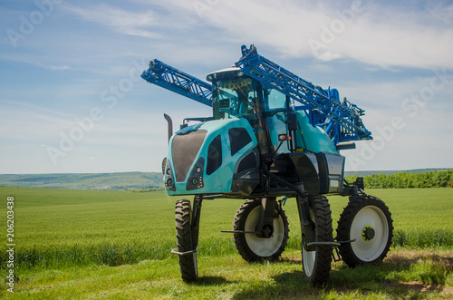 Agricultural sprayers, spray chemicals on young wheat.