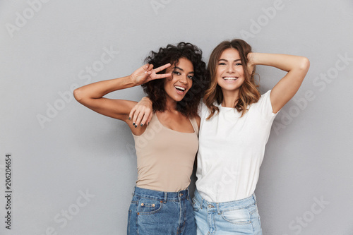 Portrait of two happy young women standing together