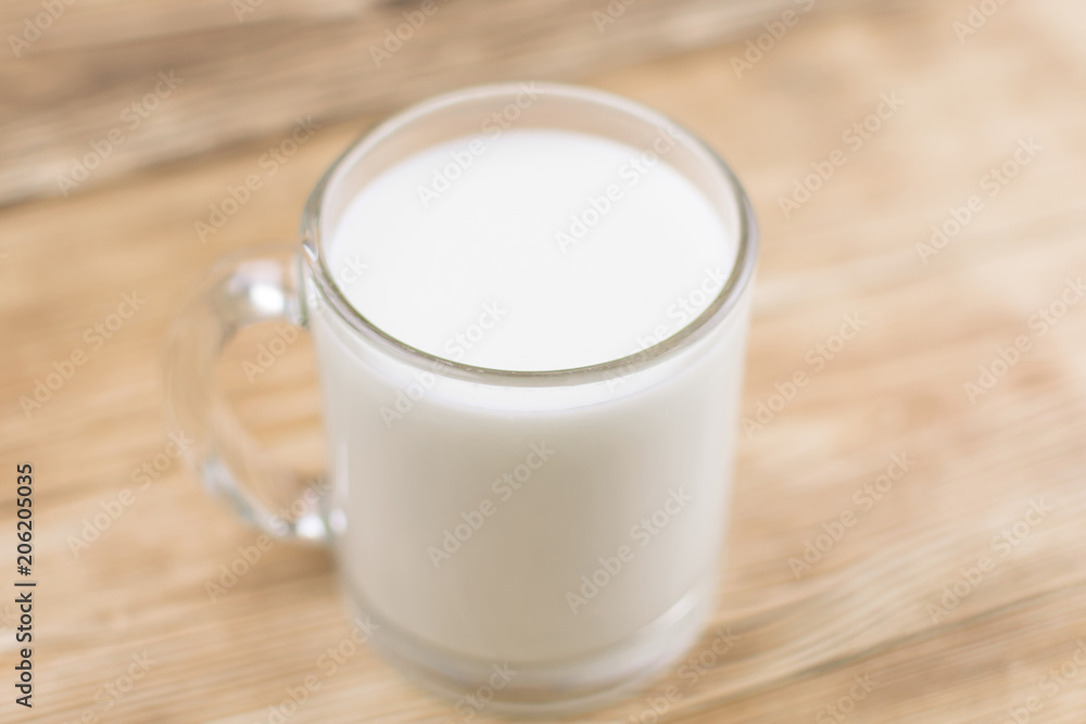 Glass kefir (milk) on a wooden background. The concept of diet, weight loss. Glass kefir (milk) on a wooden background. The concept of diet, weight loss.