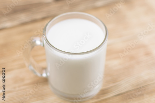 Glass kefir (milk) on a wooden background. The concept of diet, weight loss.