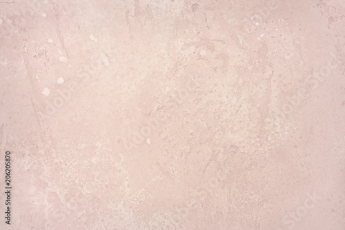 Light pink stone wall or floor.