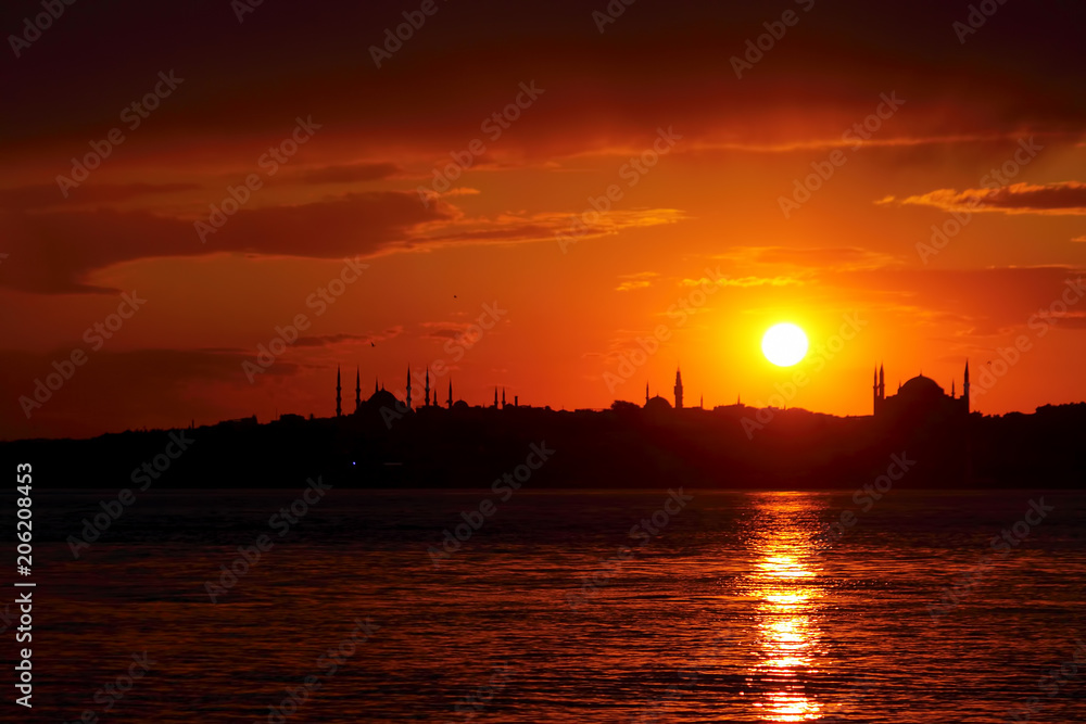 Naklejka premium Ramadan time with the muslim city istanbul silhouette