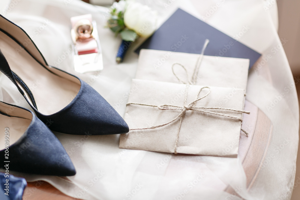 Wedding morning. Blue beautiful bride shoes- wedding details. close up view womans accessories. Wedding morning. Blue beautiful bride shoes- wedding details. close up view womans accessories.