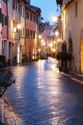 Fototapeta Naklejka Na Ścianę i Meble -  streets at night in San Quirico d'Orcia after rain, Tuscany, Italy