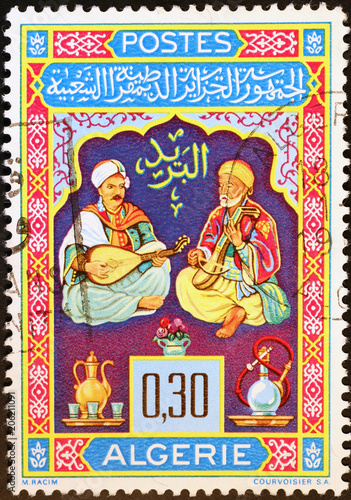 Two algerian musicians on postage stamp