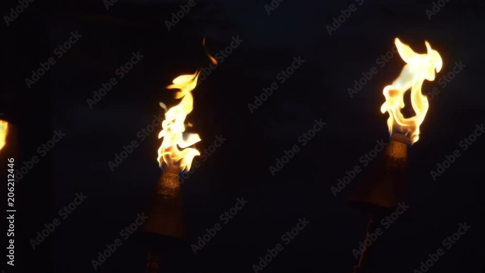 Tiki Torch Flames Waikiki beach in Honolulu Hawaii in slow motion 180fps