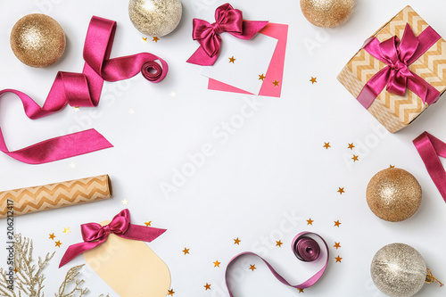 Beautiful Christmas decorations and ribbon on white background, top view