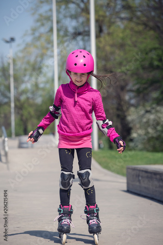 Little girl rollerskating.