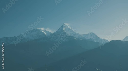 Time-lapse Dust of Snow blowing on Mountain before Sunrise view landscape from Poon Hill, Annapurna range in April 2 photo
