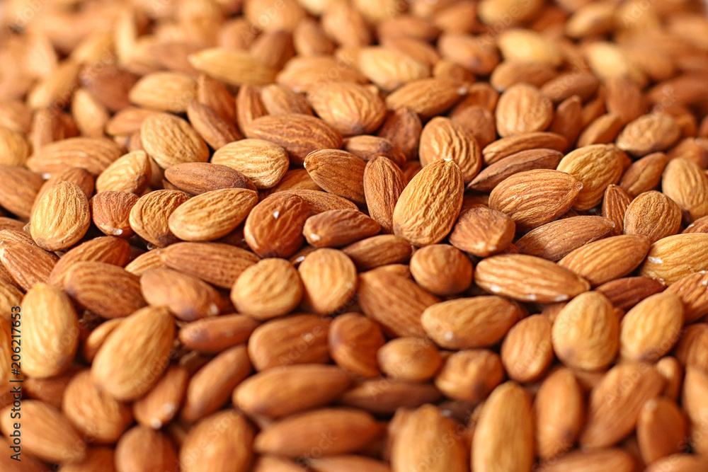The almond on the counter of the store. Walnut background with soft focus. The almond on the counter of the store. Walnut background with soft focus.