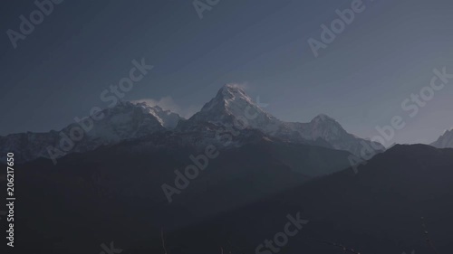 Time-lapse Dust of snow blowing on Mountain before Sunrise view landscape from Poon Hill, Annapurna range in April  photo