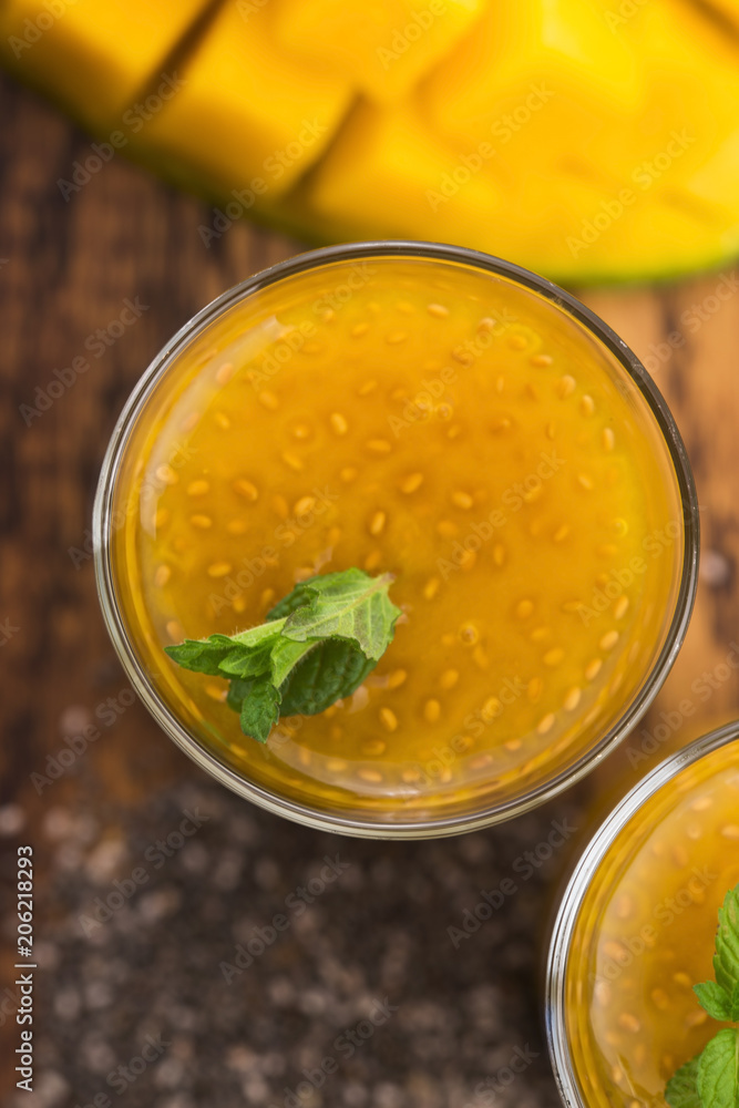 Fresh mango smoothie in glass with chia seeds Fresh mango smoothie in glass with chia seeds