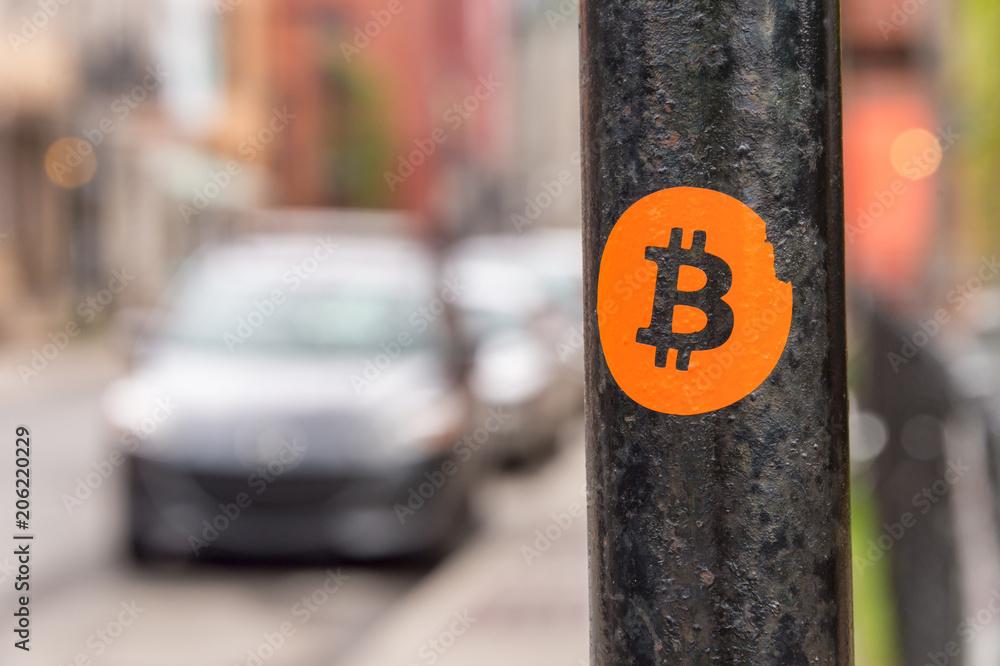 Bitcoin sticker on a street sign post - obrazy, fototapety, plakaty 