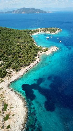 Aerial drone bird's eye photo of tropical paradise island beach with emerald crystal clear waters