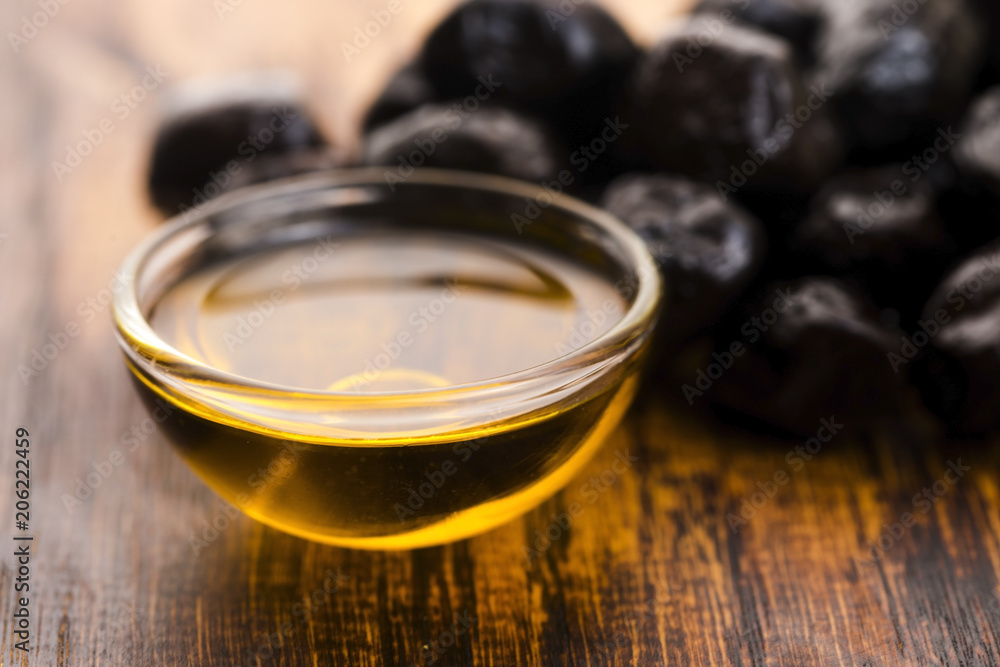 Close up of black olives and olive oil Close up of black olives and olive oil