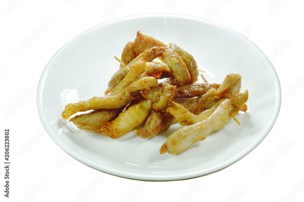 fried slice pork stabbing with wooden stick on plate fried slice pork stabbing with wooden stick on plate
