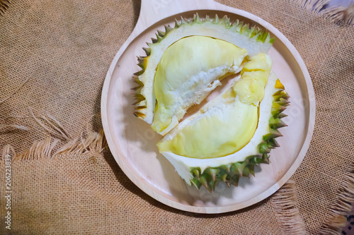 Durian fruit on wooden plate