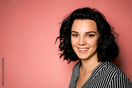 Young women on pink background