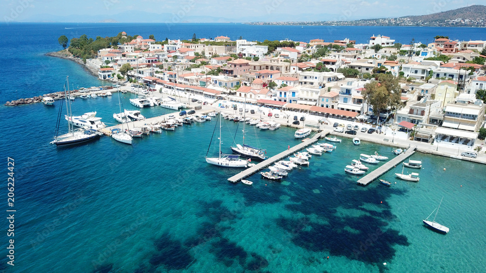 Fototapeta premium Aerial drone bird's eye view photo of port and traditional fishing village of Perdika in island of Aigina, Saronic Gulf, Greece