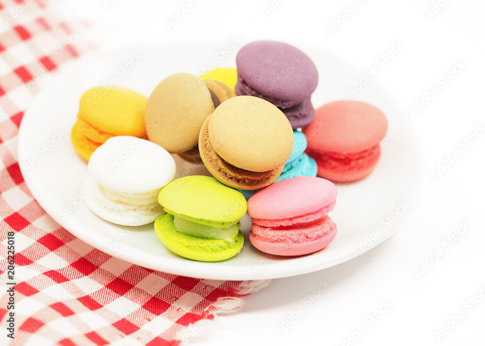 Colorful macaron cookies on white background, copy space. select focus Colorful macaron cookies on white background, copy space. select focus