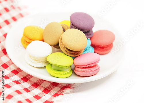 Colorful macaron cookies on white background, copy space. select focus