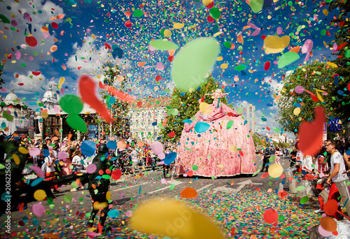 confetti falling during a festival or carnival in the city