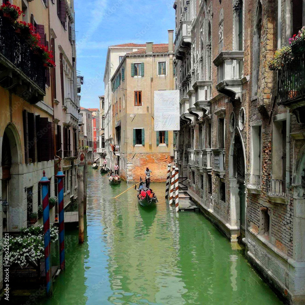 canal in venice and gondolas