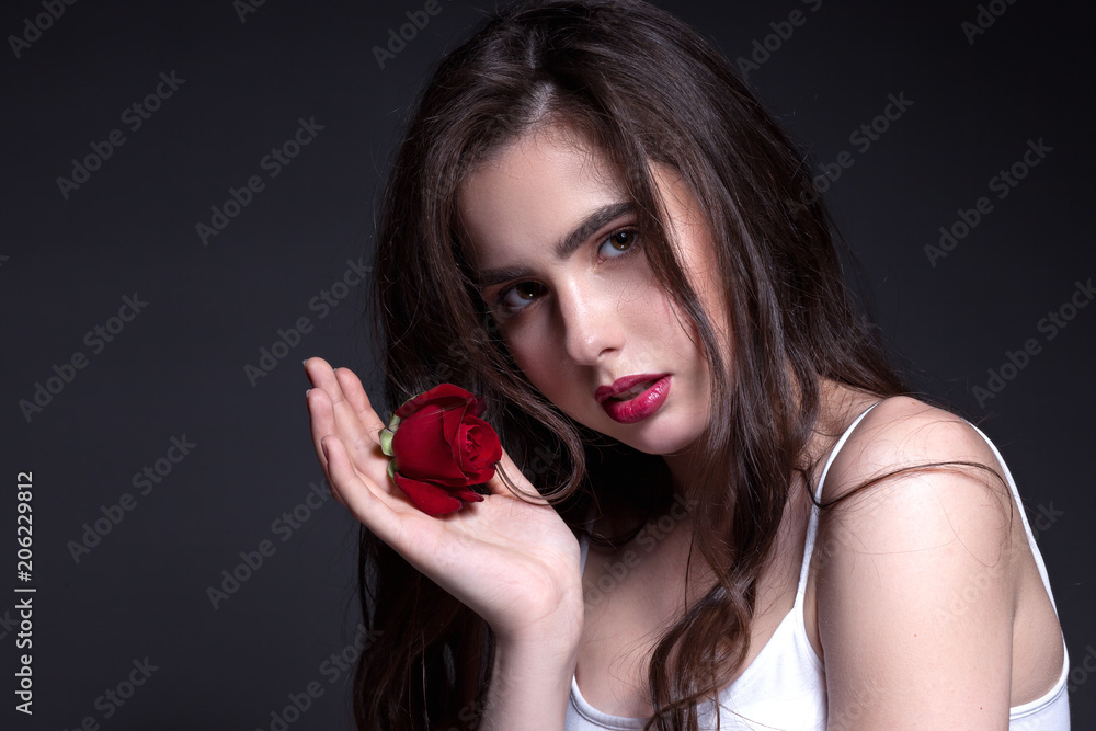 Classic portrait of a teenage girl in a white shirt. Classic portrait of a teenage girl in a white shirt.