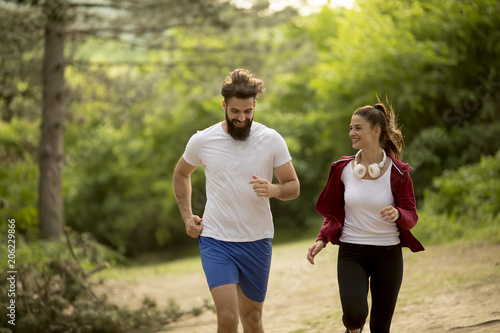 Couple jogging outdoors in nature