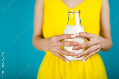 Woman holding a bottle of milk