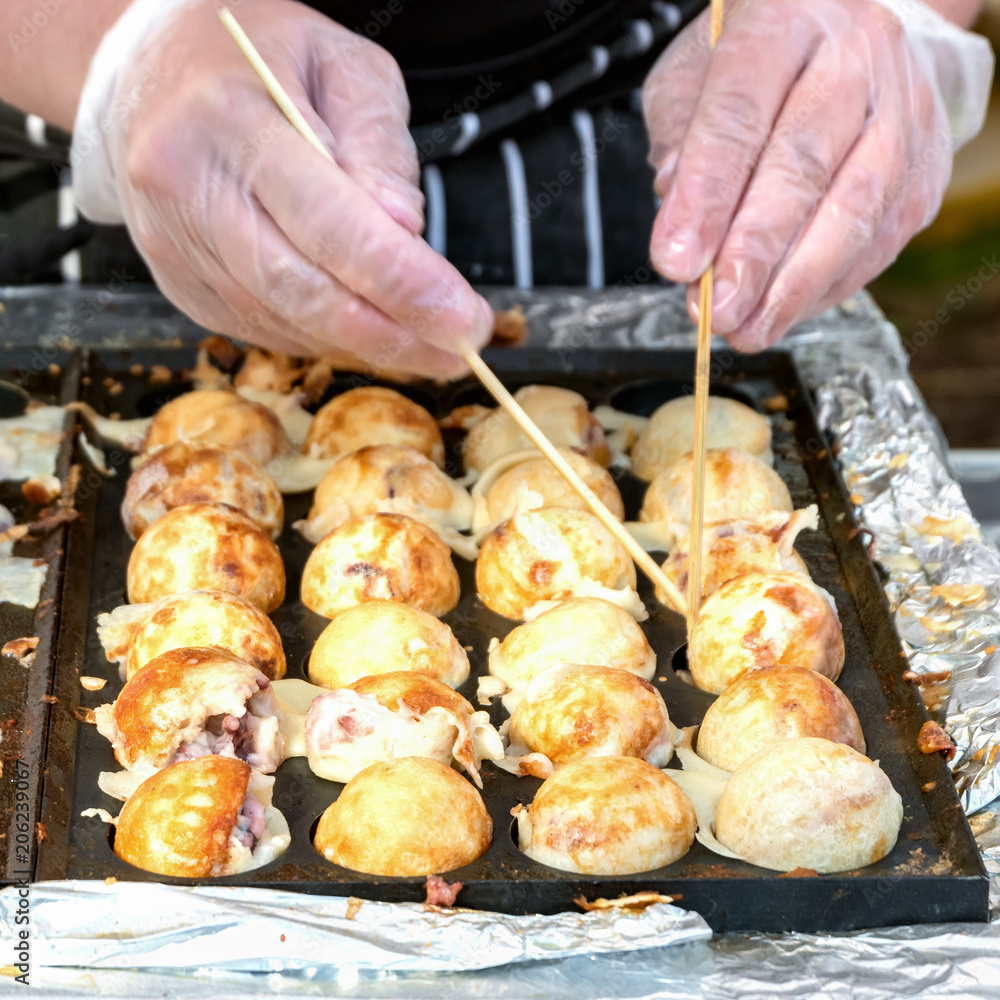 Naklejka premium Process to Cooking Takoyaki on hot pan Famous food Osaka Japan street food