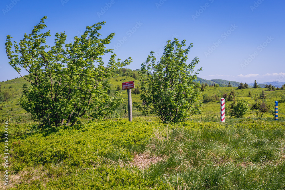 Fototapeta premium Warning sign 'Border zone - entry is not allowed' - on a Poland and Ukraine border in Bieszczady Mountains National Park, Poland